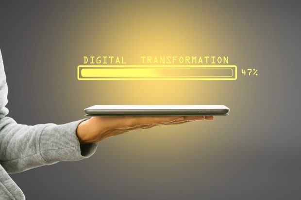 hand-holding-tablet-with-abstract-glowing-loading-2026-01-11-08-35-25-utc